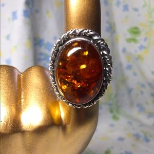 Amber in silver setting ring